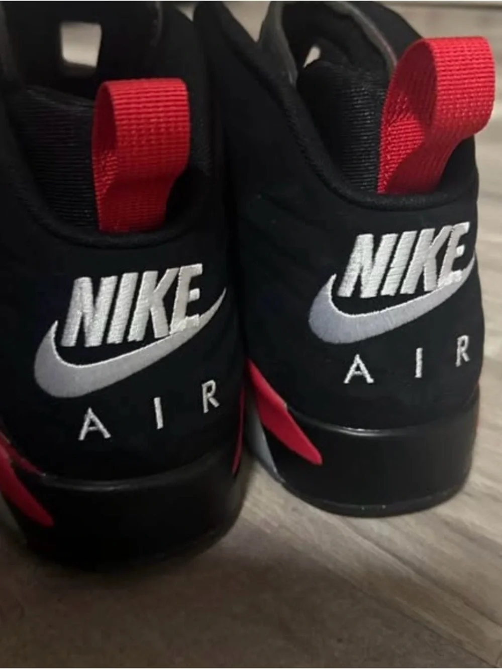 Jordan Black High-Top Sneakers with Red Heel Pull